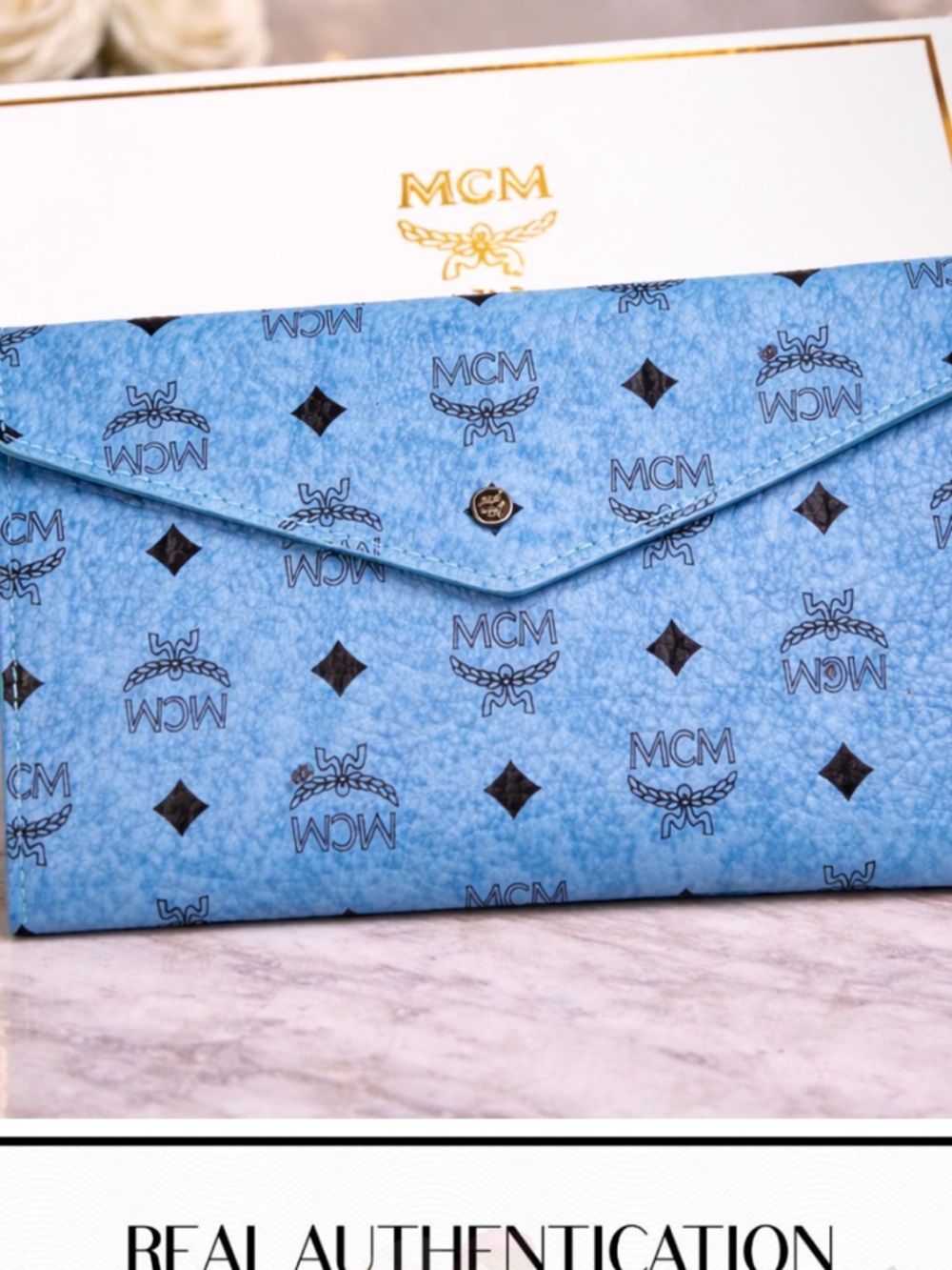 MCM Sky Blue Logo Envelope Clutch